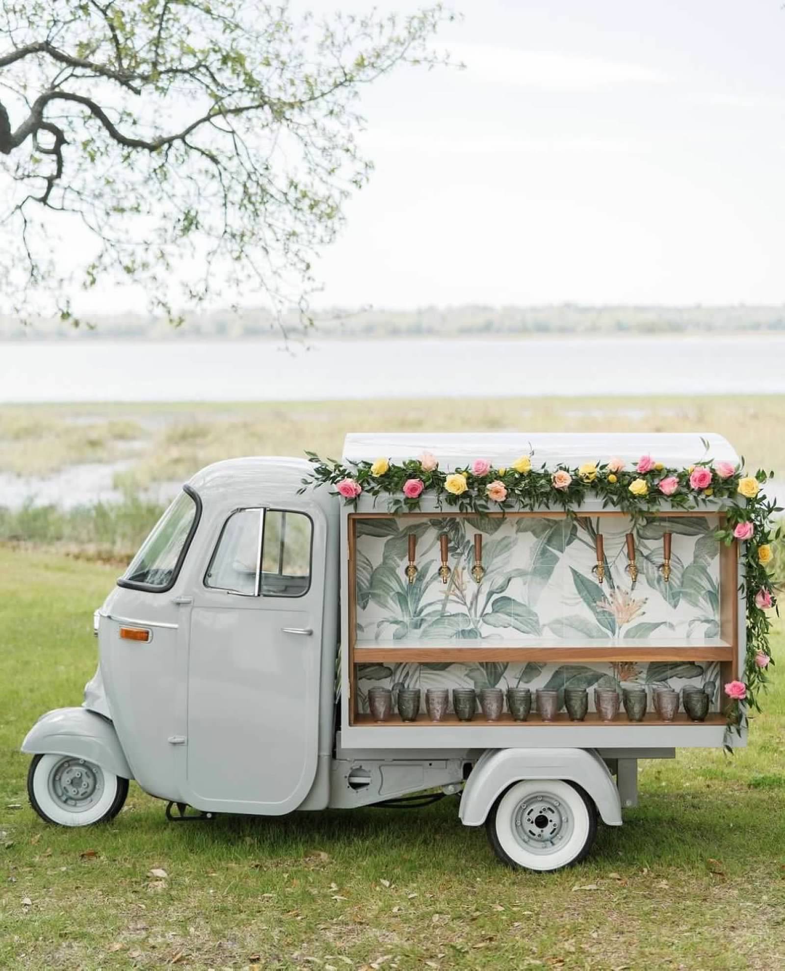 White Shimmer Ape at waterfront with flowers